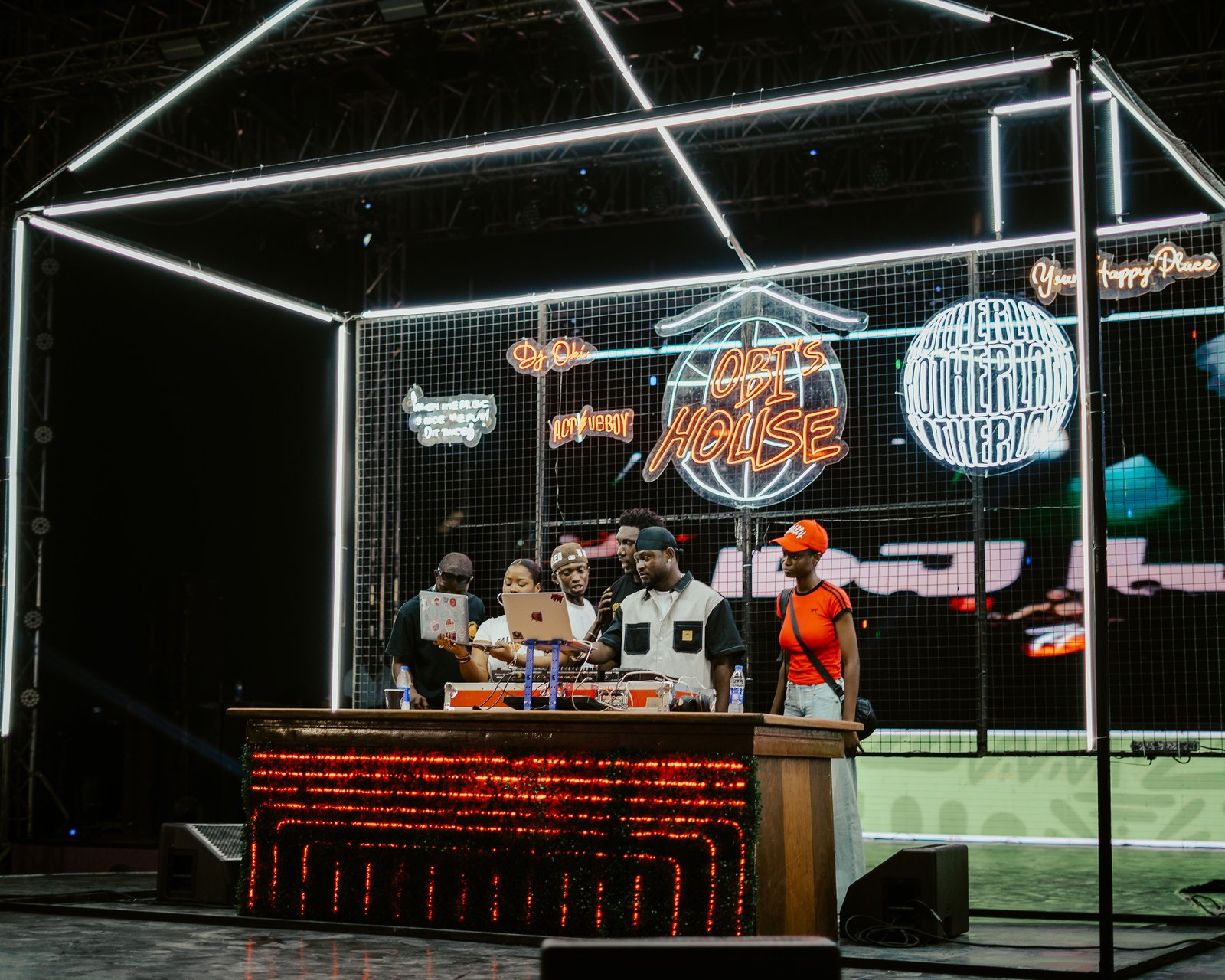 A performer on stage in front of a large crowd